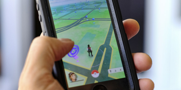 Pokemon Go is displayed on a cell phone in Los Angeles on Friday, July 8, 2016. Just days after being made available in the U.S., the mobile game Pokemon Go has jumped to become the top-grossing app in the App Store. And players have reported wiping out in a variety of ways as they wander the real world, eyes glued to their smartphone screens, in search of digital monsters. (AP Photo/Richard Vogel)