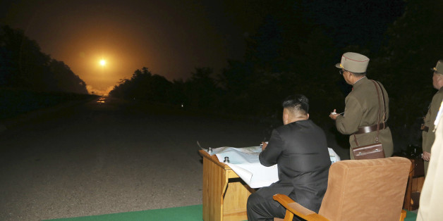 North Korean leader Kim Jong Un provides field guidance during a tactical rocket firing drill carried out by units of the Korean People's Army (KPA) Strategic Force in the western sector of the front in this undated photo released by North Korea's Korean Central News Agency (KCNA) in Pyongyang on July 10, 2014. REUTERS/KCNA (NORTH KOREA - Tags: POLITICS MILITARY) ATTENTION EDITORS ? THIS PICTURE WAS PROVIDED BY A THIRD PARTY. REUTERS IS UNABLE TO INDEPENDENTLY VERIFY THE AUTHENTICITY, CONTENT, L