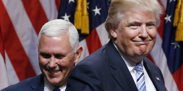 Republican U.S. presidential candidate Donald Trump steps away after greeting Indiana Governor Mike Pence (L) during the introduction of Pence as his vice presidential running mate in New York City, U.S., July 16, 2016. REUTERS/Carlo Allegri