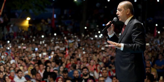 ISTANBUL, TURKEY - JULY 19: Turkish President Recep Tayyip Erdogan addresses the crowd who gathered in front of his residence in Kisikli to protest against Parallel State/Gulenist Terrorist Organization's failed military coup attempt in Istanbul, Turkey on July 19, 2016. (Photo by Turkish Presidency/Murat Cetinmuhurdar/Anadolu Agency/Getty Images)