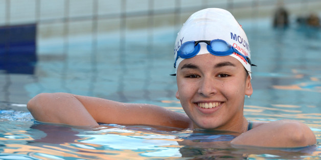 Libyan swimmer Daniah Hagul, 17, poses for a picture as she trains at the national pool in Msida, Malta, on July 15, 2016. Calm and composed, with an infectious smile, Daniah Hagul is heading to Rio with a heavy weight on her shoulders: she will be the first woman swimmer to represent Libya at the Olympics after the fall of longtime dictator Moamer Kadhafi. / AFP / Matthew Mirabelli (Photo credit should read MATTHEW MIRABELLI/AFP/Getty Images)