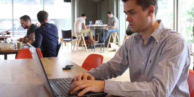 Frank Bertele, CEO of tech startup NETZ, works on his laptop in London Wednesday June 29, 2016. Within 24 hours of Britainâs vote to leave the European Union, London-based technology startup Netz saw five investors suspend hundreds of thousands of pounds in promised money. (AP Photo/Leonora Beck)