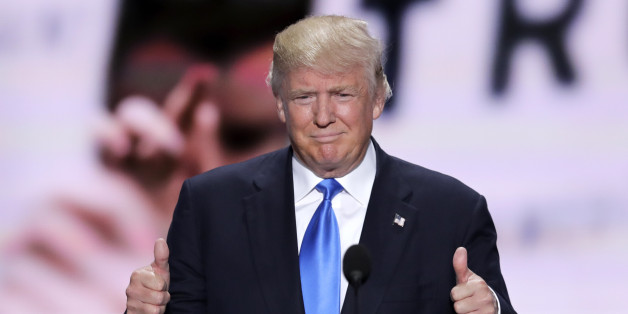 Republican Presidential Candidate Donald Trump flash two thumbs up as he introduces his wife Melania during the opening day of the Republican National Convention in Cleveland, Monday, July 18, 2016. (AP Photo/J. Scott Applewhite)