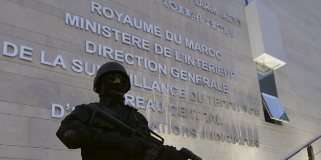 A Moroccan policeman stands guard at the Central Bureau of Judicial Investigation office in Sale, March 23, 2015. Moroccan authorities said on Monday they had dismantled a militant cell planning to create an Islamic State affiliate in the North African kingdom, seizing guns and accusing its members of plotting attacks. Reporters were shown six pistols and ammunition seized from a hideout near the southern city of Agadir, in the offices of the BCIJ in the city of Sale. REUTERS/Stringer