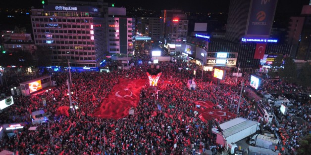 ANKARA,TURKEY - JULY 20: People gather at the Kizilay Square to protest against the Parallel State/Gulenist Terrorist Organization's failed military coup attempt, in Ankara, Turkey on July 20, 2016. (Photo by AA/Anadolu Agency/Getty Images)