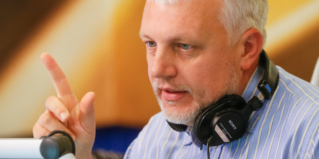 Journalist Pavel Sheremet talks on the air at a radio station in Kiev, Ukraine, October 11, 2015. Picture taken October 11, 2015. REUTERS/Valentyn Ogirenko