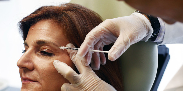 Carolyn Landis, of Roslyn, receives botox treatment from Dr. Kaveh Alizadeh at the Long Island Plastic Surgical Group at the Americana Manhasset luxury shopping destination in Manhasset, New York September 30, 2010. Patients of the office will have the opportunity to schedule an Americana personal shopper on their behalf to shop for them during their appointment. REUTERS/Shannon Stapleton (UNITED STATES - Tags: SOCIETY HEALTH)