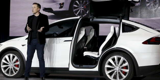 Tesla Motors CEO Elon Musk introduces the falcon wing door on the Model X electric sports-utility vehicles during a presentation in Fremont, California September 29, 2015. Tesla Motors delivered the first of its long-awaited Model X electric sports-utility vehicles on Tuesday, a product investors are counting on to make the pioneering company profitable after years of losses. REUTERS/Stephen Lam