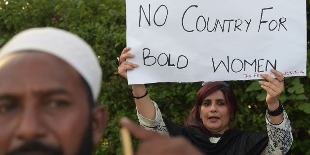 An Pakistani civil society activist carries a placard during a protest in Islamabad on July 18, 2016 against the murder of social media celebrity Qandeel Baloch by her own brother.The brother of a murdered Pakistani celebrity said he is 'not embarrassed' to have killed her, as Qandeel Baloch's death reignited polarising calls for action against the 'epidemic' of honour killings. The strangling of Baloch, judged by many in deeply conservative Muslim Pakistan as infamous for selfies and videos tha