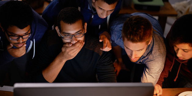 Shot of a group of shocked-looking young man staring at a monitor in a dark roomhttp://195.154.178.81/DATA/i_collage/pi/shoots/783867.jpg