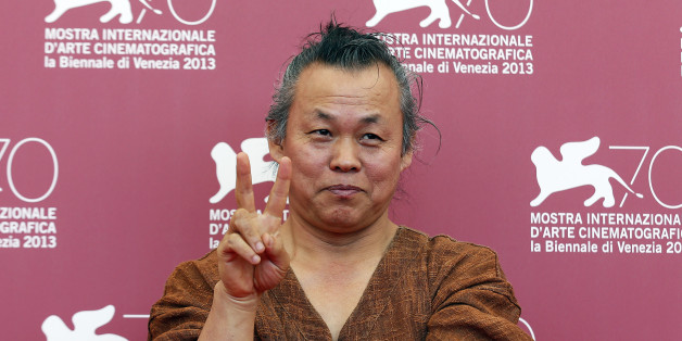 Director Kim Ki-duk poses during a photocall for his movie "Moebius" during the 70th Venice Film Festival in Venice September 3, 2013. The movie debuts at the festival. REUTERS/Alessandro Bianchi (ITALY - Tags: ENTERTAINMENT)