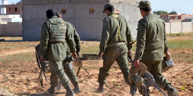 Tunisian special forces carry boxes of ammunition left behind by jihadists in the southern town of Ben Guerdane, near the Libyan border, during clashes with jihadists on March 8, 2016 a day after the attack on the border town.
Tunisian Prime Minister Habib Essid said around 50 extremists were believed to have taken part in Monday's coordinated attack on an army barracks and police and National Guard posts in the border town of Ben Guerdane.
/ AFP / FATHI NASRI (Photo credit should read FATHI NASRI/AFP/Getty Images)