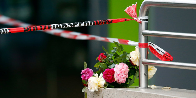 Flowers are placed near the Olympia shopping mall, where yesterday's shooting rampage started, in Munich, Germany July 23, 2016. REUTERS/Michael Dalder