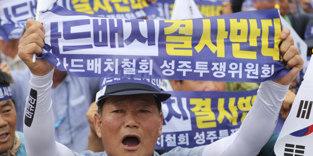 A resident in a rural South Korean town shouts slogans protesting a plan to deploy an advanced U.S. missile defense system called Terminal High-Altitude Area Defense, or THAAD, in their neighborhood, in Seoul, South Korea, Thursday, July 21, 2016. The missile system will be deployed in southeastern South Korea, Seoul officials announced Wednesday, July 13, angering not only North Korea and China but also local residents who fear potential health hazards they believe the U.S. system might cause.