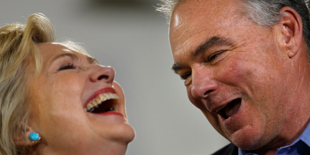 Democratic U.S. presidential candidate Hillary Clinton and U.S. Senator Tim Kaine (D-VA) react during a campaign rally at Ernst Community Cultural Center in Annandale, Virginia, U.S., July 14, 2016. REUTERS/Carlos Barria