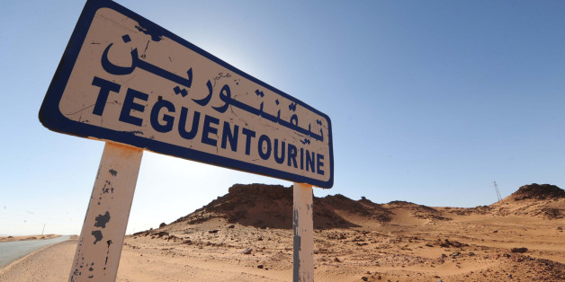 A picture shows a road sign indicating Tiguentourine near In Amenas on a road leading to a gas complex where Islamist gunmen had taken hostages in the desert in Algeria's deep south on January 19, 2013. Islamist gunmen killed seven foreign hostages in Algeria before being gunned down by special forces in a final assault on a remote desert gas complex, state television said. The 11 heavily armed men from a group known as 'Signatories in Blood' had been holed up at the In Amenas complex since they
