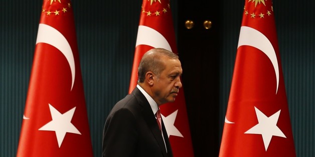 Turkish President Tayyip Erdogan leaves after a news conference following the National Security Council and cabinet meetings at the Presidential Palace in Ankara, Turkey, July 20, 2016. REUTERS/Umit Bektas