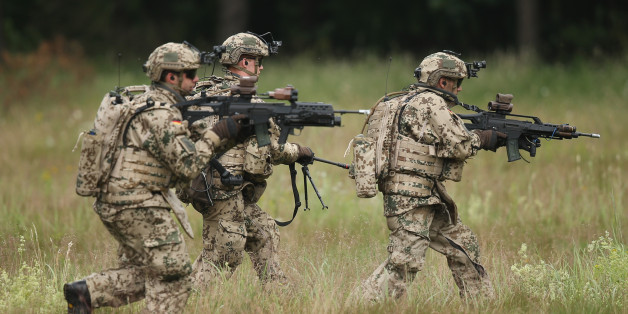 NEUSTADT AM RUEBENBERGE , GERMANY - JUNE 29: Members of the Bundeswehr, the German armed forces, participate in a demonstration of capabilities of Panzergranadierbataillon 33 of the 1st Panzer Division (1. Panzerdivision) that included the new Puma infantry fighting vehicle on June 29, 2016 near Neustadt am Ruebenberge, Germany. The Bundeswehr is aquirung the Puma in phases and the vehicle replaces the Marder. (Photo by Sean Gallup/Getty Images)