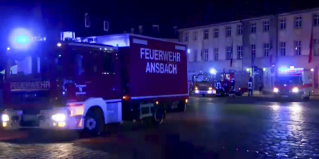 GERMANY OUT - In this image taken from video fire trucks and ambulances stand in the city center of Ansbach near Nuremberg, southern Germany, Monday morning, July 25, 2016, after a man was killed when an explosive device he was believed to be carrying went off near an open-air music festival, injuring 10 others. (News5 via AP)