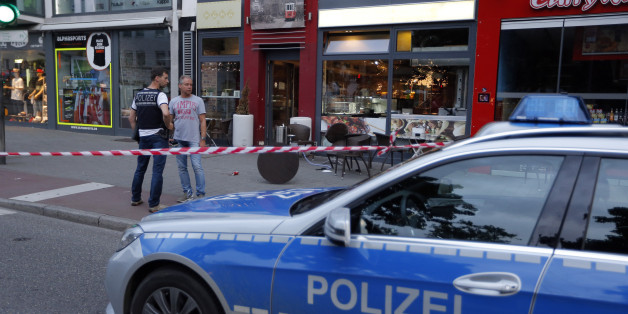 Police patrol outside where a 21-year-old Syrian refugee killed a woman with a machete and injured two other people in the city of Reutlingen, Germany July 24, 2016. REUTERS/Vincent Kessler