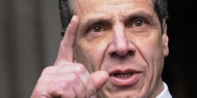 New York Governor Andrew Cuomo talks with reporters after his public inauguration ceremony at the state Capitol in Albany, New York January 1, 2011. REUTERS/Hans Pennink (UNITED STATES - Tags: POLITICS HEADSHOT)