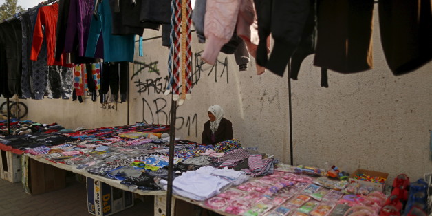 Meriem, 60, a street vendor, sits as she waits for customers in Kasserine, where young people have been demonstrating for jobs since last week, January 30, 2016. "I am not pleased at all by the political and economic situation of Tunisia. There is a lack of security, money, jobs; the poverty has clearly been on the rise since the 2011 revolution. I wish, we can go back to the time before the revolution," Meriem said. REUTERS/Zohra Bensemra