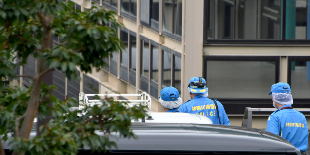 Police officers are pictured outside the Tsukui Yamayuri En care centre where a knife-wielding man went on a rampage in the city of Sagamihara, Kanagawa prefecture, some 50 kms (30 miles) west of Tokyo on July 26, 2016.At least 19 people were killed when the man went on a rampage at the care centre for the mentally disabled in Japan early on July 26, a fire official said. / AFP / TOSHIFUMI KITAMURA (Photo credit should read TOSHIFUMI KITAMURA/AFP/Getty Images)