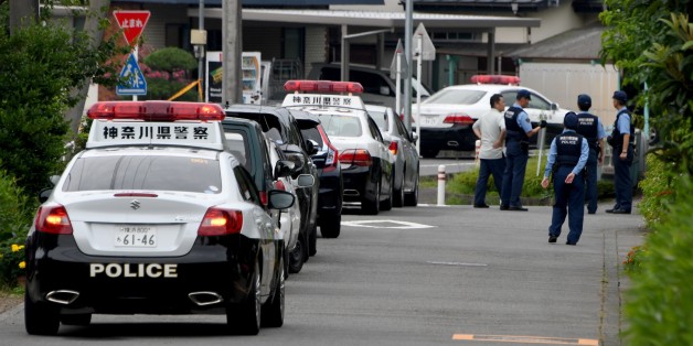Police officers stand guard near the Tsukui Yamayuri En care centre where a knife-wielding man went on a rampage in the city of Sagamihara, Kanagawa prefecture, some 50 kms (30 miles) west of Tokyo on July 26, 2016.At least 19 people were killed when the man went on a rampage at the care centre for the mentally disabled in Japan early on July 26, a fire official said. / AFP / TOSHIFUMI KITAMURA (Photo credit should read TOSHIFUMI KITAMURA/AFP/Getty Images)