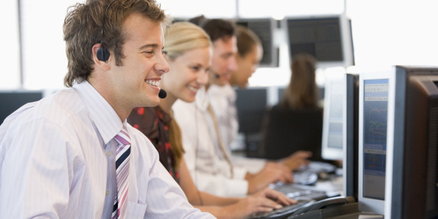Stock Traders Working At Computers
