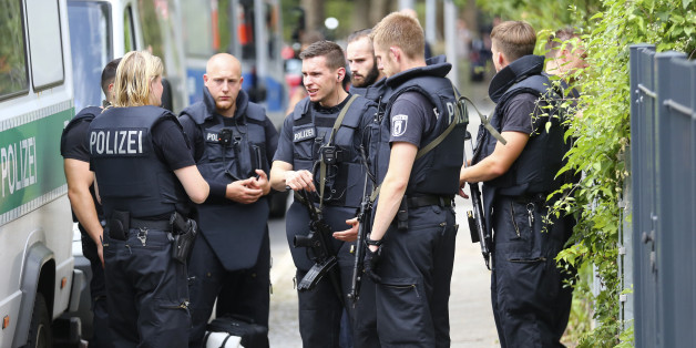 Special police stand outside the university clinic in Steglitz, a southwestern district of Berlin, July 26, 2016 after a doctor had been shot at and the gunman had killed himself. REUTERS/Hannibal Hanschke
