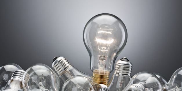 Illuminated light bulb in pile