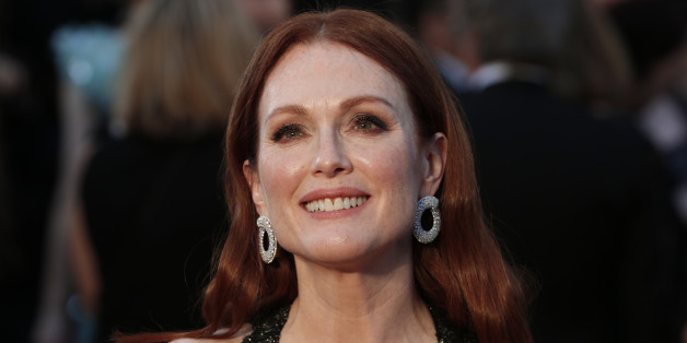 Presenter Julianne Moore wearing a black Chanel gown with beaded embellishments, arrives at the 88th Academy Awards in Hollywood, California February 28, 2016. REUTERS/Lucas Jackson