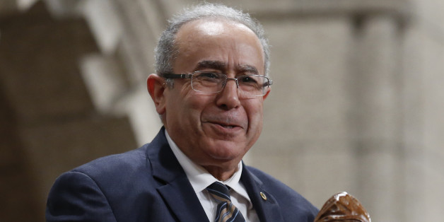 Algeria's Foreign Minister Ramtane Lamamra reacts while being recognized by the Speaker in the House of Commons on Parliament Hill in Ottawa September 29, 2014. REUTERS/Chris Wattie (CANADA - Tags: POLITICS)