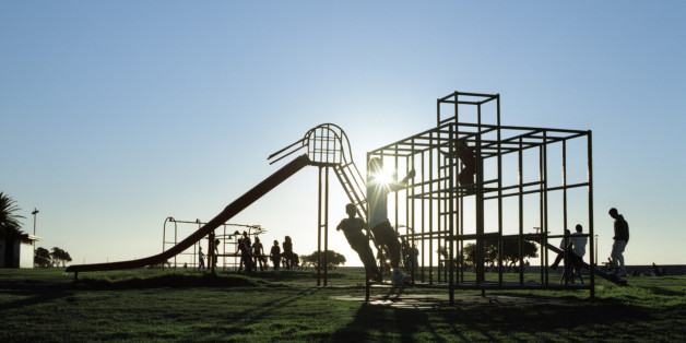 Silhouettes of children in playground