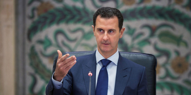 A handout picture released by the official Syrian Arab News Agency (SANA) on July 11, 2016 shows Syrian President Bashar al-Assad during a meeting with members of his government, in the capital Damascus. / AFP / SANA / - (Photo credit should read -/AFP/Getty Images)