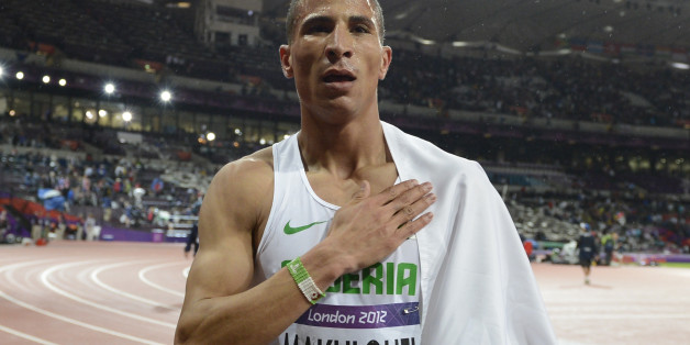 Algeria's Taoufik Makhloufi celebrates after winning the men's 1500m final at the athletics event during the London 2012 Olympic Games on August 7, 2012 in London. AFP PHOTO / ADRIAN DENNIS (Photo credit should read ADRIAN DENNIS/AFP/GettyImages)