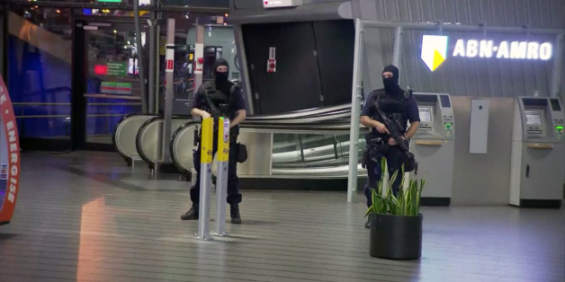This image made from a video from RTL shows police at Schiphol Airport in Amsterdam, Tuesday, April 12, 2016. Military police have arrested a man and are conducting an investigation at the airport after a report of a "suspicious situation." (RTL via AP) NETHERLANDS OUT; LUXEMBOURG OUT