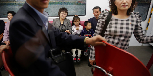 Passengers travel on a recently introduced new train during a government organised visit to the subway for foreign reporters in central Pyongyang, North Korea May 7, 2016. REUTERS/Damir Sagolj