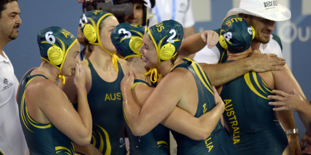 Australian players celebrate after their victory over Russia in a women's water polo semifinal at the FINA Swimming World Championships in Barcelona, Spain, Wednesday, July 31, 2013 .(AP Photo/Manu Fernandez)