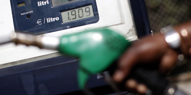 An attendant prepares to refuel a car at a petrol station in downtown Rome March 13, 2012. Current world oil prices are not justified, Kuwait's oil minister told state television in comments broadcast on Sunday, adding that the Gulf state's current production rate will not affect its level of strategic reserves. Fears of possible supply disruptions from Iran and political tensions across the Middle East have helped to drive up the price of benchmark Brent crude oil ,which is trading at just under $126 a barrel. REUTERS/Tony Gentile (ITALY - Tags: POLITICS BUSINESS ENERGY)