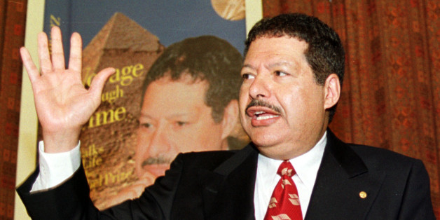 Egyptian-American Nobel chemistry laureate Ahmed Zewail gestures to reporters in Cairo, Feb. 4, 2002. In a new autobiography called "Voyage Through Time...Walks of Life to the Nobel Prize," Zewail narrates his journey from a small village on the west bank of the Nile Delta to the California Institute of Technology. He teaches physics and chemistry there now and directs the Laboratory for Molecular Sciences. (AP Photo/Mahmoud Nour Eddin)