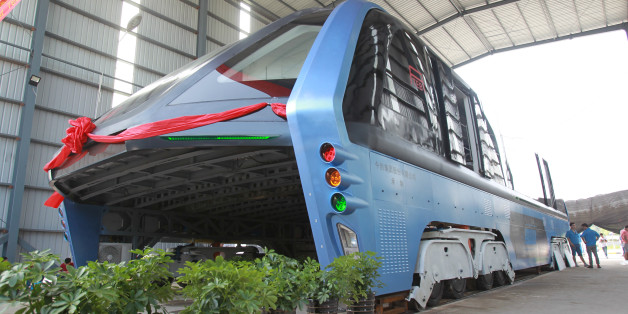 A model of an innovative street-straddling bus called Transit Elevated Bus is seen after a test run in Qinhuangdao, Hebei Province, China, August 3, 2016. The test bus currently consists of one segment, and is capable of carrying 300 people, according to local media. REUTERS/Stringer ATTENTION EDITORS - THIS IMAGE WAS PROVIDED BY A THIRD PARTY. EDITORIAL USE ONLY. CHINA OUT. NO COMMERCIAL OR EDITORIAL SALES IN CHINA.