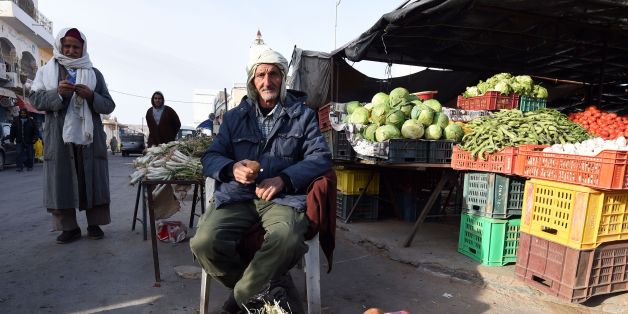 Tunisian vendor Chahbani Larayadh, 80, sells white truffles at a market on February 6, 2016 in the town of Ben Guerdane, some 40 kilometres west of the Libyan border.
Tunisia on February 6, 2016 completed the construction of a barrier along its border with Libya, months after attacks on its national museum and a beach resort that killed dozens of tourists. Defence Minister Farhat Horchani told reporters that the construction of berms and water-filled trenches marks 'an important day' for Tunisia in its struggle against 'terrorism'.
/ AFP / FETHI BELAID (Photo credit should read FETHI BELAID/AFP/Getty Images)