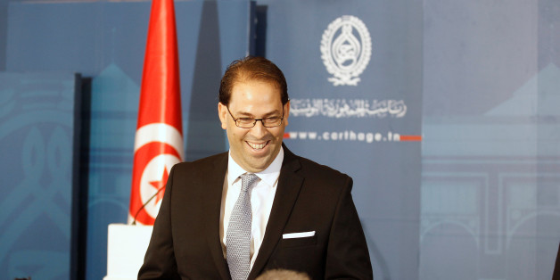 Tunisia's Prime Minister-designate Youssef Chahed smiles during a news conference after his meeting with Tunisia's President Beji Caid Essebsi (not pictured) in Tunisia, Tunis August 3, 2016. REUTERS/Zoubeir Souissi