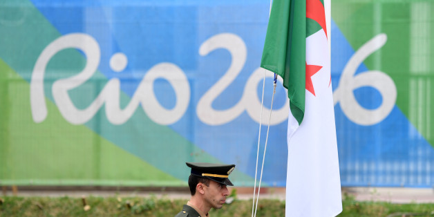 The Algerian flag is raised upon the arrival of Algeria's Olympic team at the Athletes' Village ahead of the Rio 2016 Olympic Games in Rio de Janeiro on August 3, 2016. / AFP / Andrej ISAKOVIC (Photo credit should read ANDREJ ISAKOVIC/AFP/Getty Images)