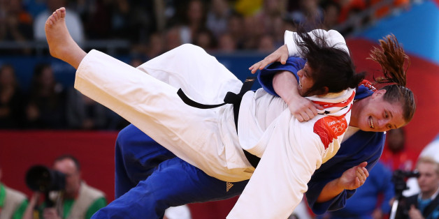 LONDON, ENGLAND - AUGUST 03: Sonia Asselah of Algeria (white) and Karina Bryant of Great Britain compete in the Women's +78 kg Judo on Day 7 of the London 2012 Olympic Games at ExCeL on August 3, 2012 in London, England. (Photo by Quinn Rooney/Getty Images)