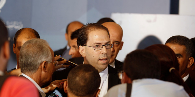 Tunisia's Prime Minister-designate Youssef Chahed speaks to journalists after his meeting with Tunisia's President Beji Caid Essebsi (not pictured) in Tunis, Tunisia August 3, 2016. REUTERS/Zoubeir Souissi