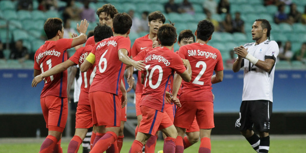Players of Korea celebrate after scoring during a group C match of the men's Olympic football tournament between Fiji and Korea at the Fonte Nova Arena in Salvador, Brazil, Thursday, Aug. 4, 2016. (AP Photo/Arisson Marinho)