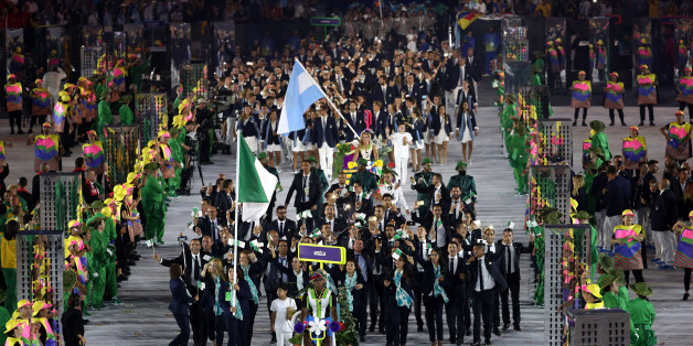 RIO DE JANEIRO, BRAZIL - AUGUST 05: Sonia Asselah of Algeria carries the flag during the Opening Ceremony of the Rio 2016 Olympic Games at Maracana Stadium on August 5, 2016 in Rio de Janeiro, Brazil. (Photo by Paul Gilham/Getty Images)