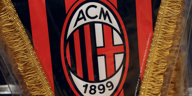 The AC Milan logo is pictured on a pennant in a soccer store in downtown Milan, Italy April 29, 2015. REUTERS/Stefano Rellandini/File Photo TPX IMAGES OF THE DAY